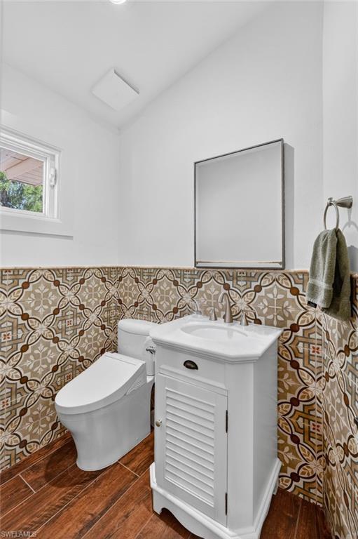 175 Palm River Boulevard Naples, FL 34110 - Photo 28 of 45 a bathroom with a sink and a mirror