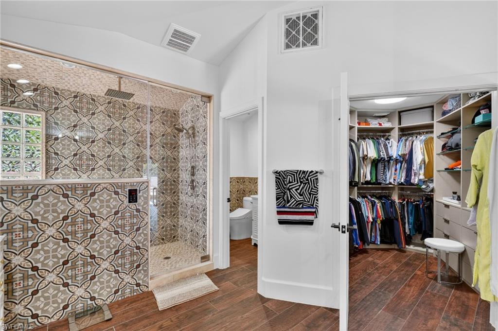 175 Palm River Boulevard Naples, FL 34110 - Photo 29 of 45 a view of a hallway with wooden floor and entryway