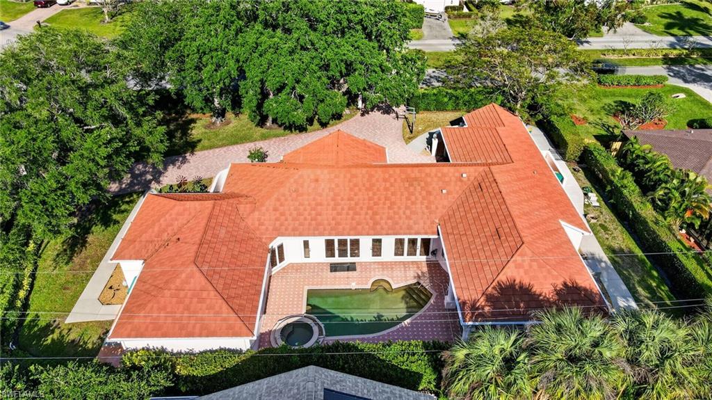 175 Palm River Boulevard Naples, FL 34110 - Photo 40 of 45 an aerial view of a house with a yard