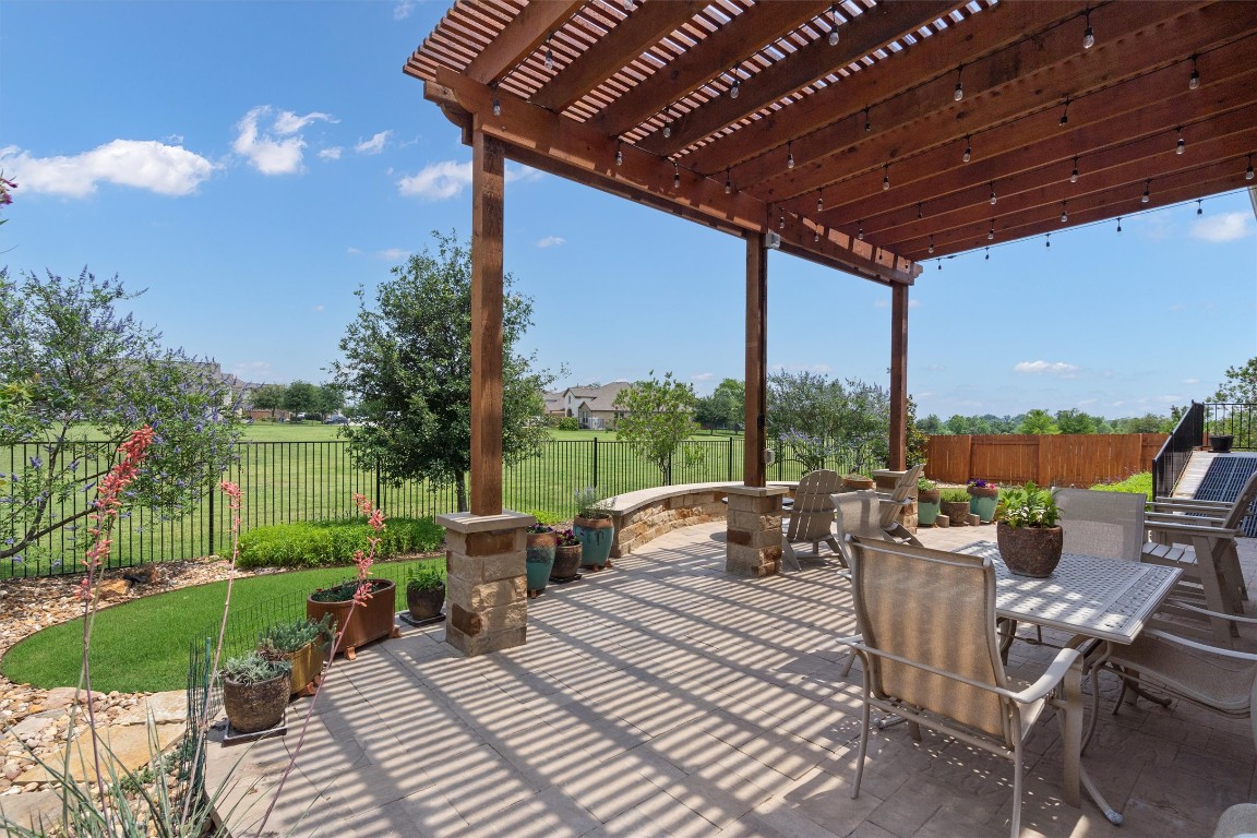 4937 Strada Drive Round Rock, TX 78665 - Photo 1 of 1 a view of a patio with couches chairs and a table and chairs with garden view