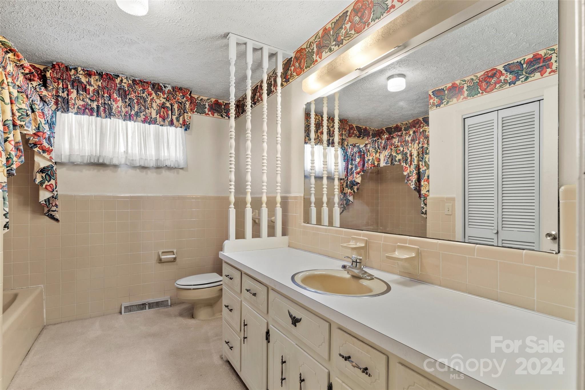 110 Stephens Drive Morganton, NC 28655 - Photo 12 of 29 a bathroom with a sink a toilet and shower