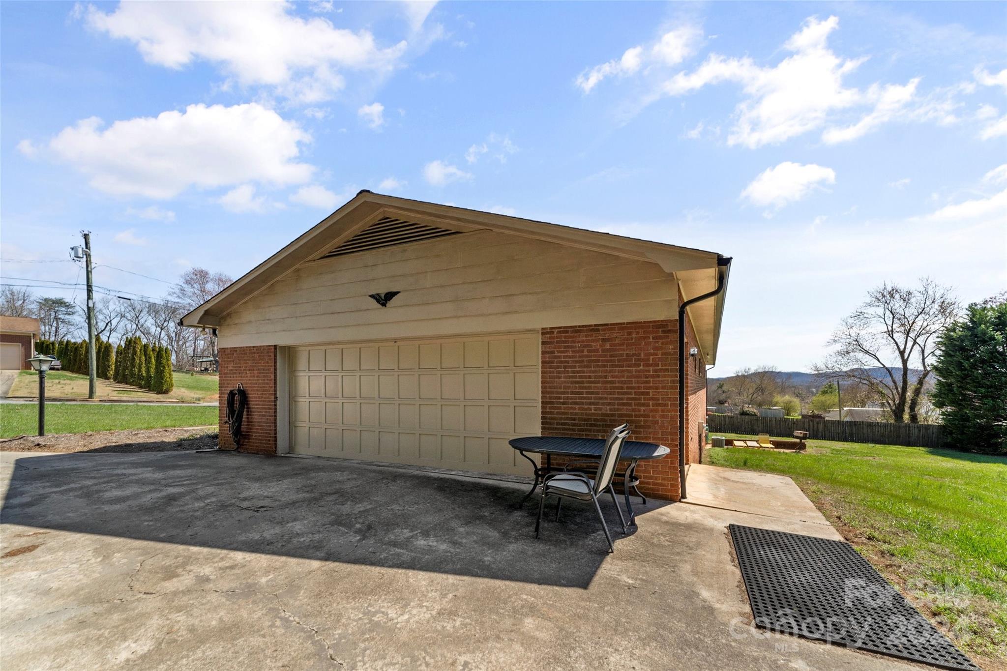 110 Stephens Drive Morganton, NC 28655 - Photo 20 of 29 a backyard of a house with outdoor seating