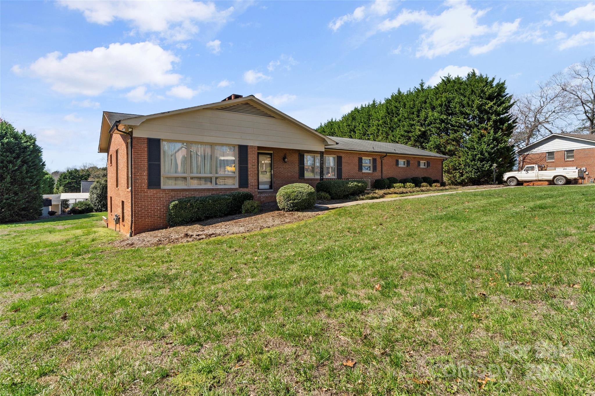 110 Stephens Drive Morganton, NC 28655 - Photo 2 of 29 a front view of a house with garden