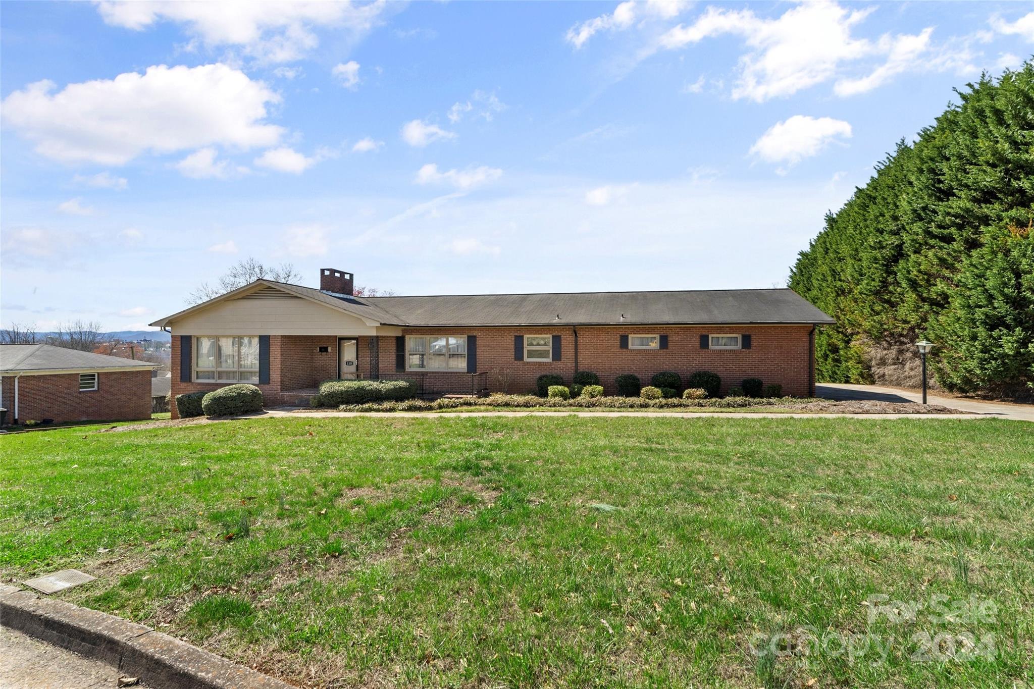 110 Stephens Drive Morganton, NC 28655 - Photo 3 of 29 a front view of a house with a garden