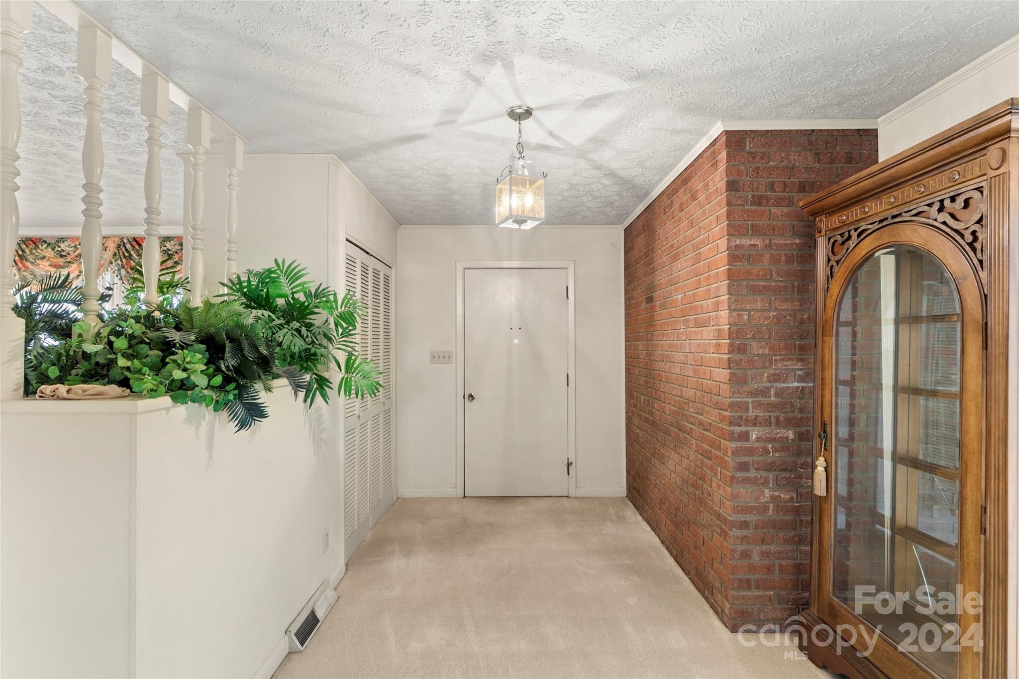 110 Stephens Drive Morganton, NC 28655 - Photo 5 of 29 a view of entryway with chandelier