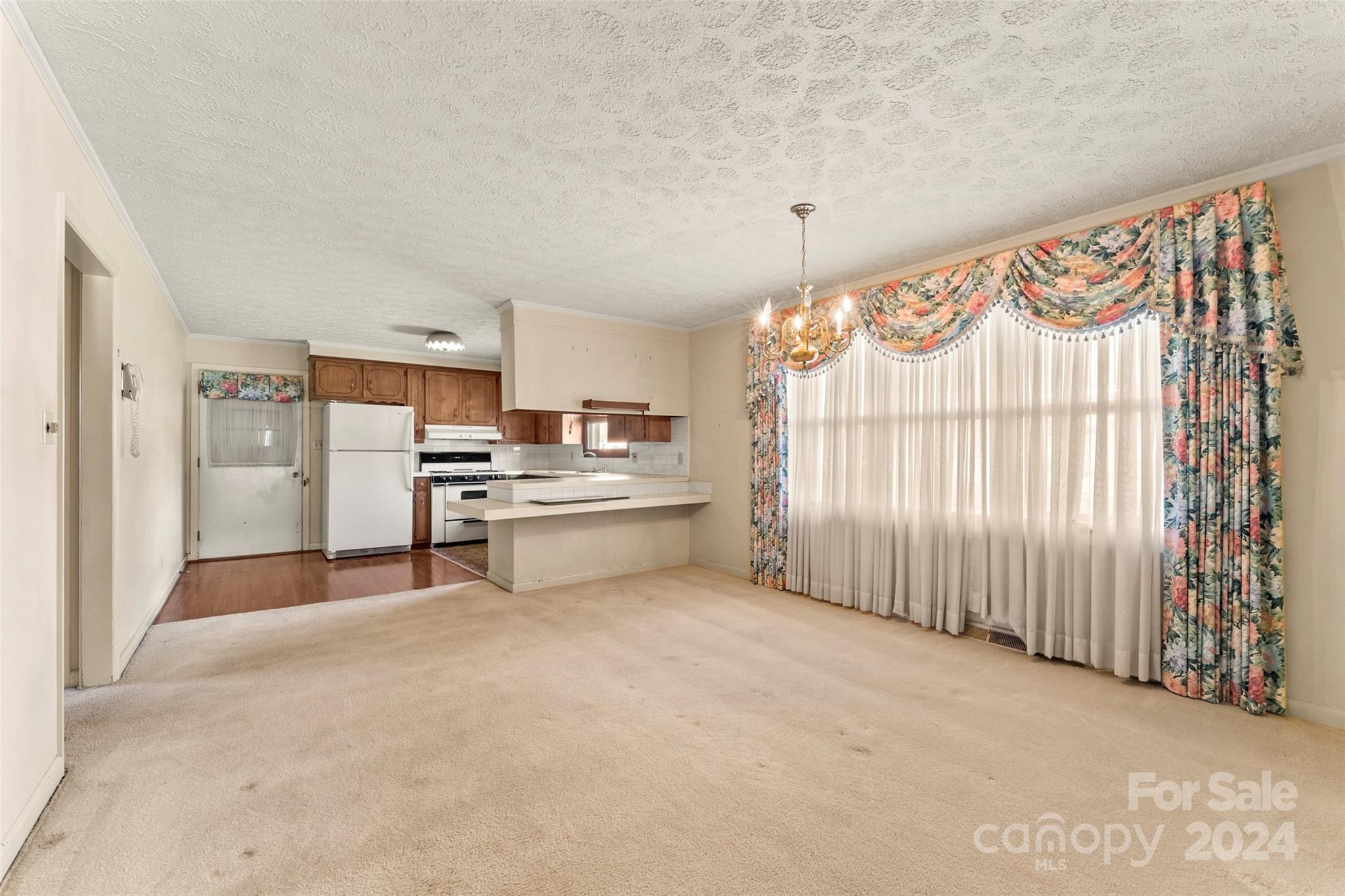 110 Stephens Drive Morganton, NC 28655 - Photo 6 of 29 a view of kitchen with cabinets and window
