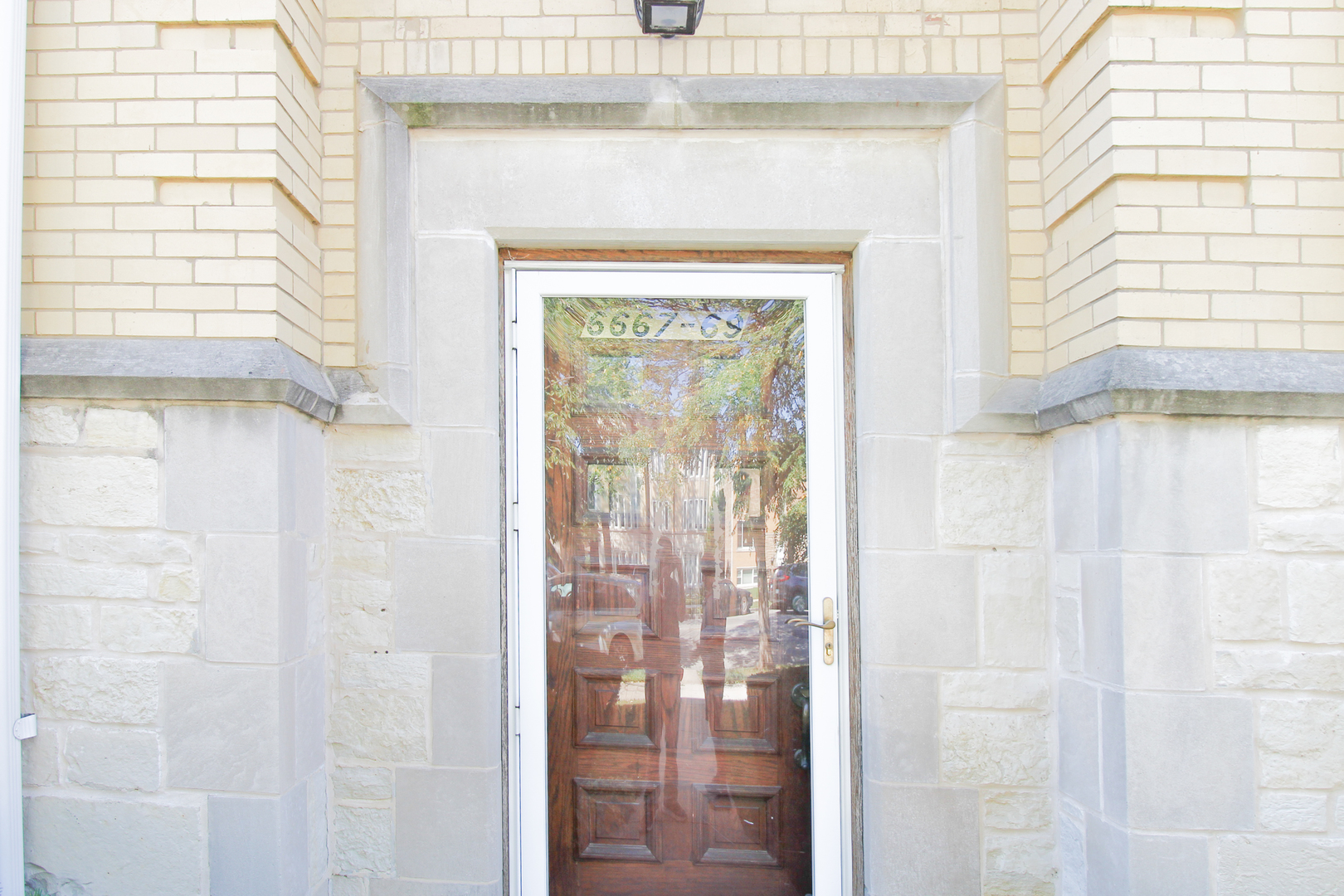 6669 West Devon Avenue, Unit 1E Chicago, IL 60631 - Photo 3 of 10 a view of a glass door with a glass door
