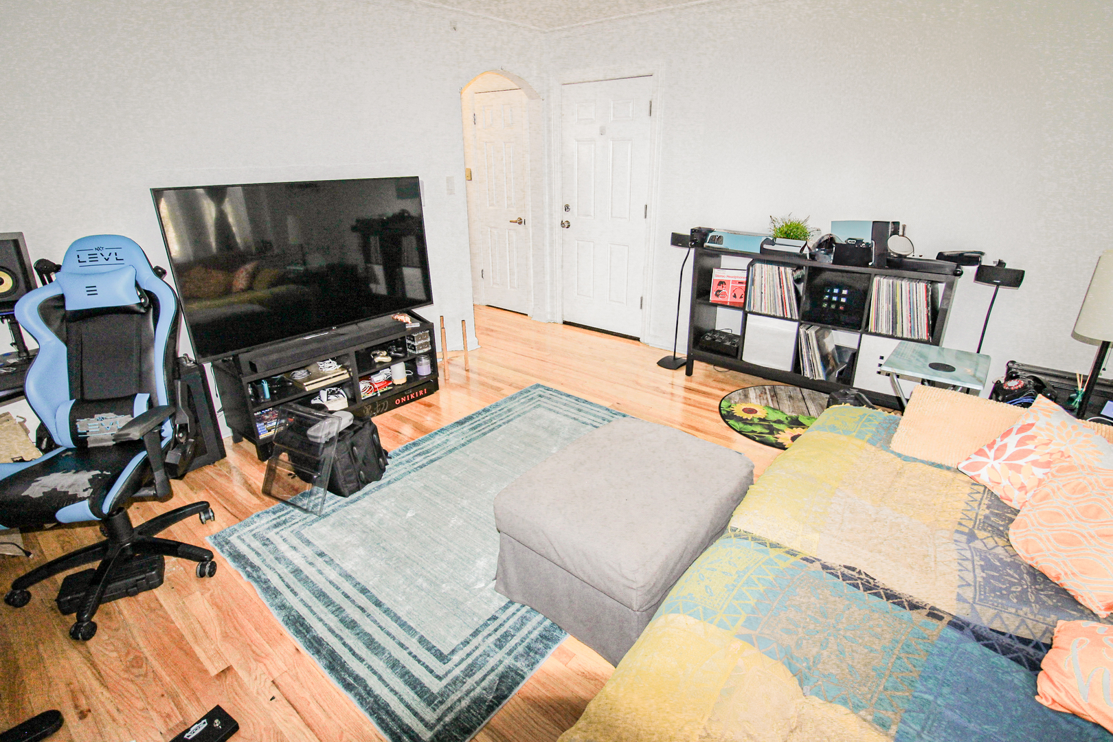6669 West Devon Avenue, Unit 1E Chicago, IL 60631 - Photo 7 of 10 a living room with furniture and a flat screen tv
