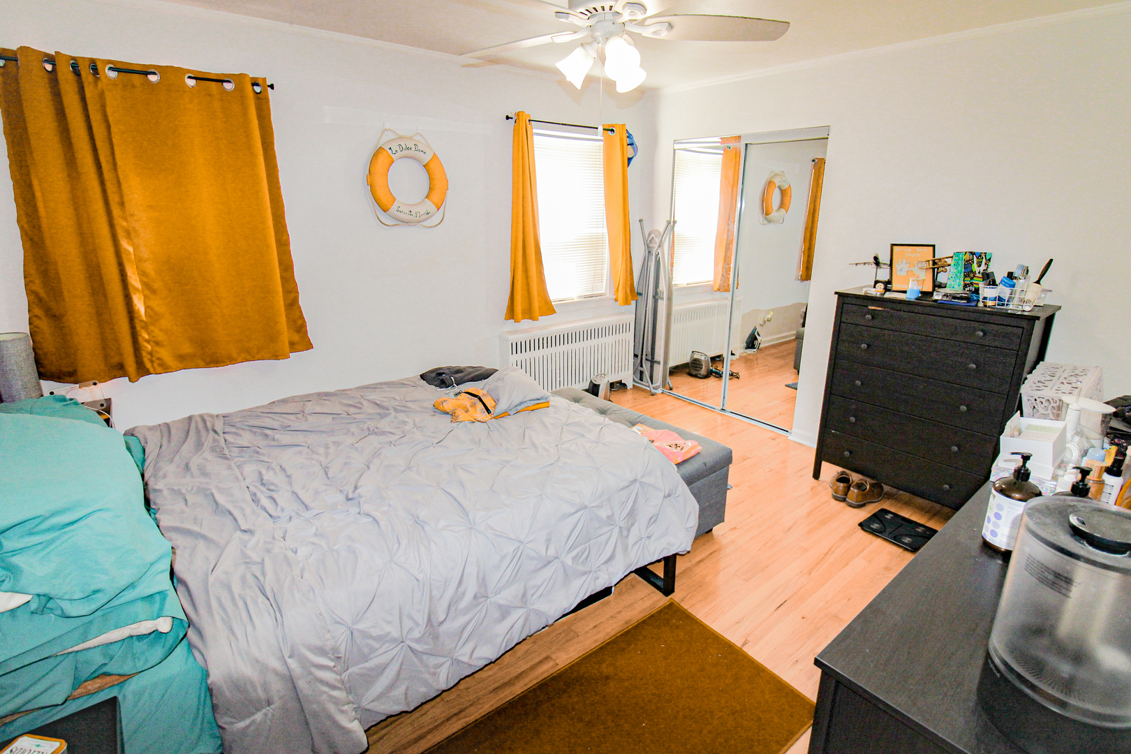 6669 West Devon Avenue, Unit 1E Chicago, IL 60631 - Photo 8 of 10 a bed sitting in a bedroom next to a window