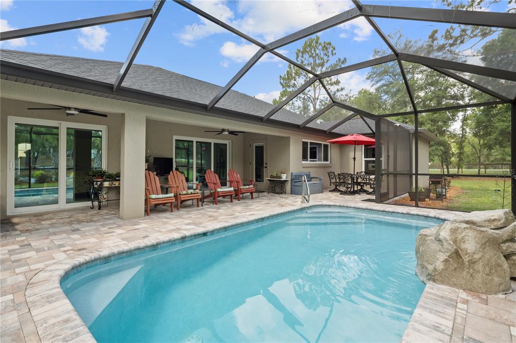 12929 Southwest 89th Street Dunnellon, FL 34432 - Photo 38 of 76 a view of a swimming pool with a patio