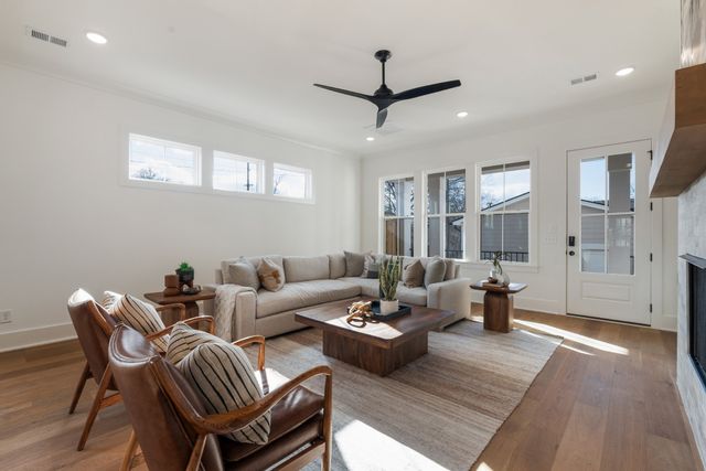a living room with furniture and a fireplace