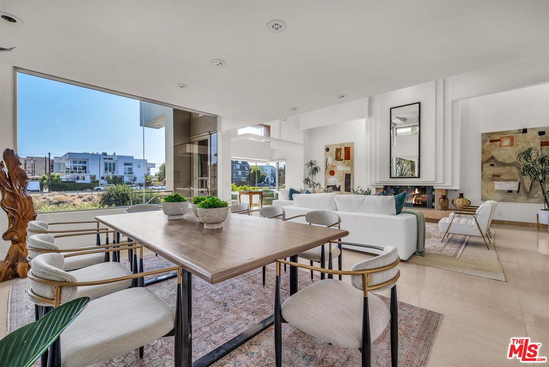 4911 Roma Court Marina del Rey, CA 90292 - Photo 12 of 58 a dining room with furniture and a floor to ceiling window