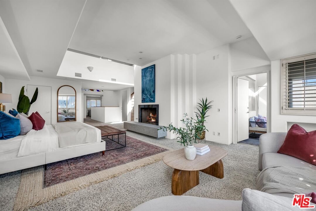 4911 Roma Court Marina del Rey, CA 90292 - Photo 25 of 58 a living room with furniture potted plant and windows