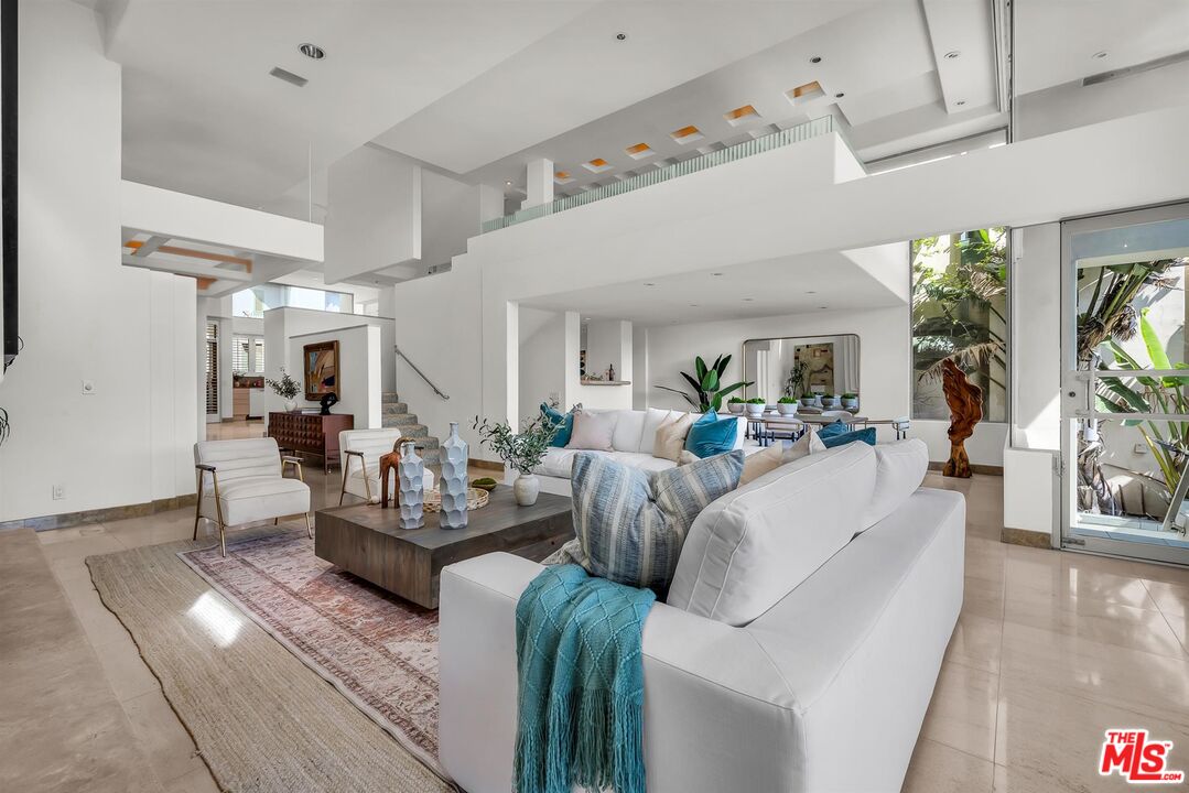 4911 Roma Court Marina del Rey, CA 90292 - Photo 6 of 58 a living room with furniture and a large window