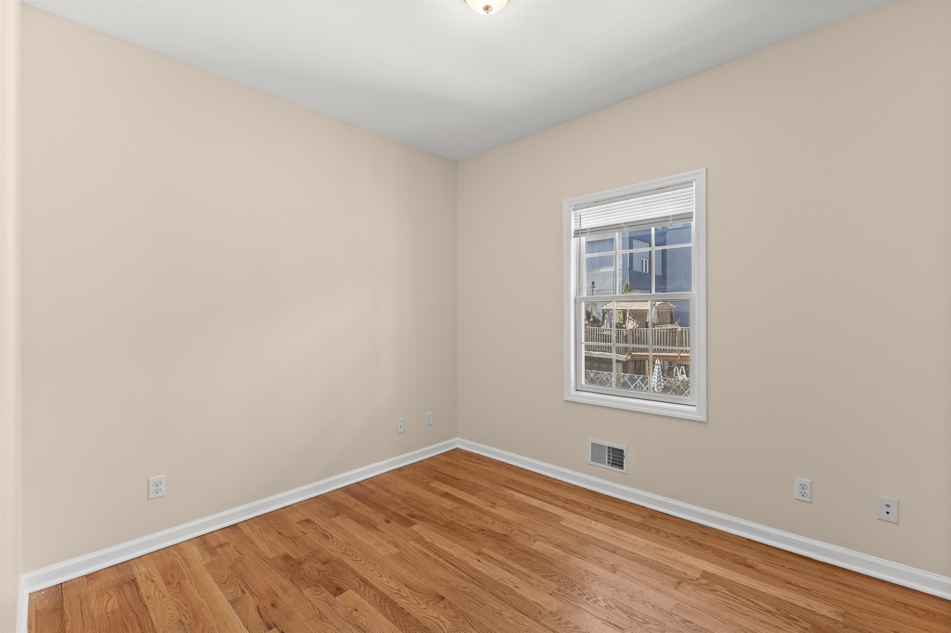 23 Reynolds Avenue, Unit 1 Harrison, NJ 07029 - Photo 17 of 23 an empty room with a window