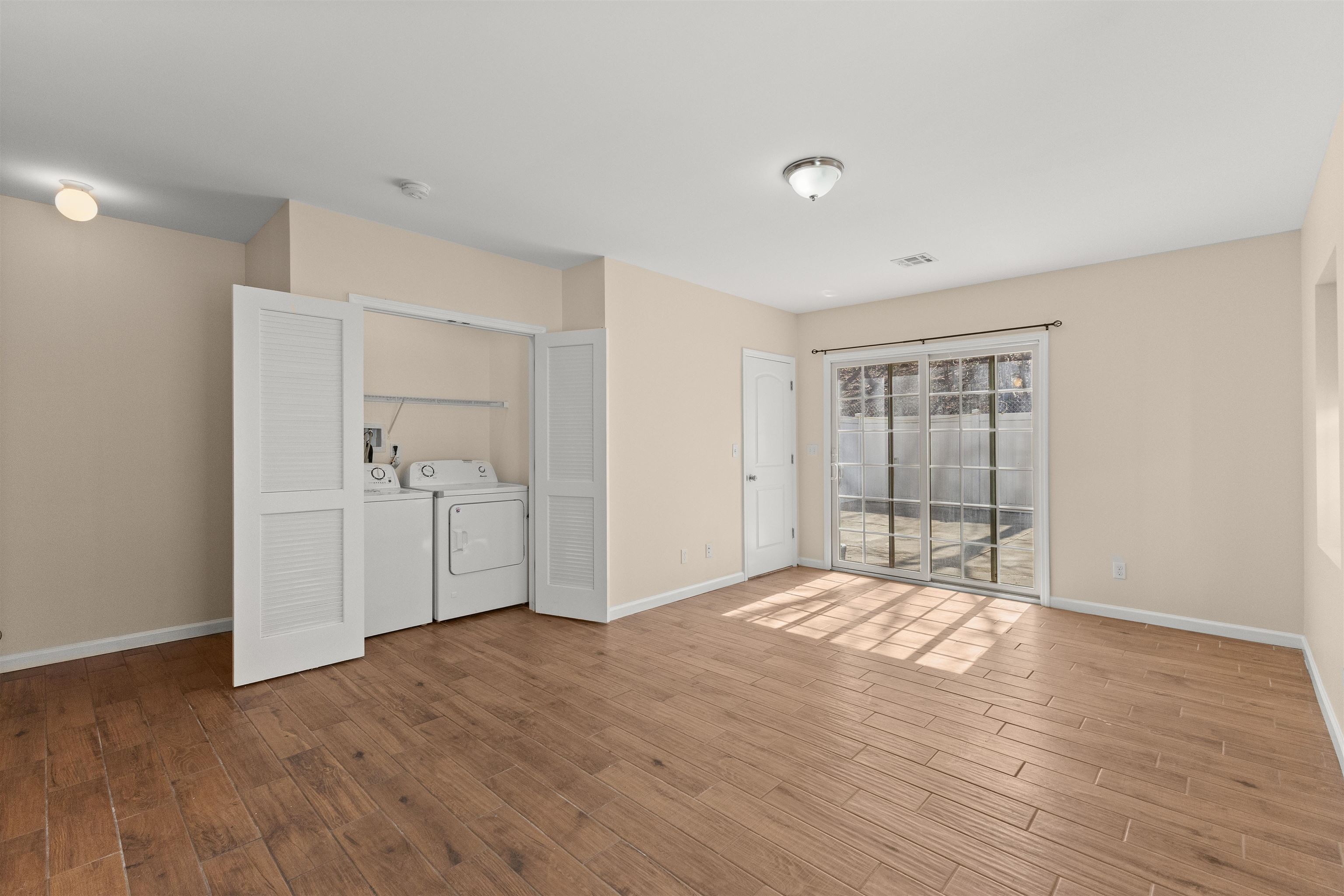 23 Reynolds Avenue, Unit 1 Harrison, NJ 07029 - Photo 20 of 23 a view of empty room with wooden floor and fan