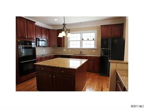 401 Third Baxter Street Fort Mill, SC 29708 - Photo 8 of 16 a kitchen with a sink appliances and cabinets