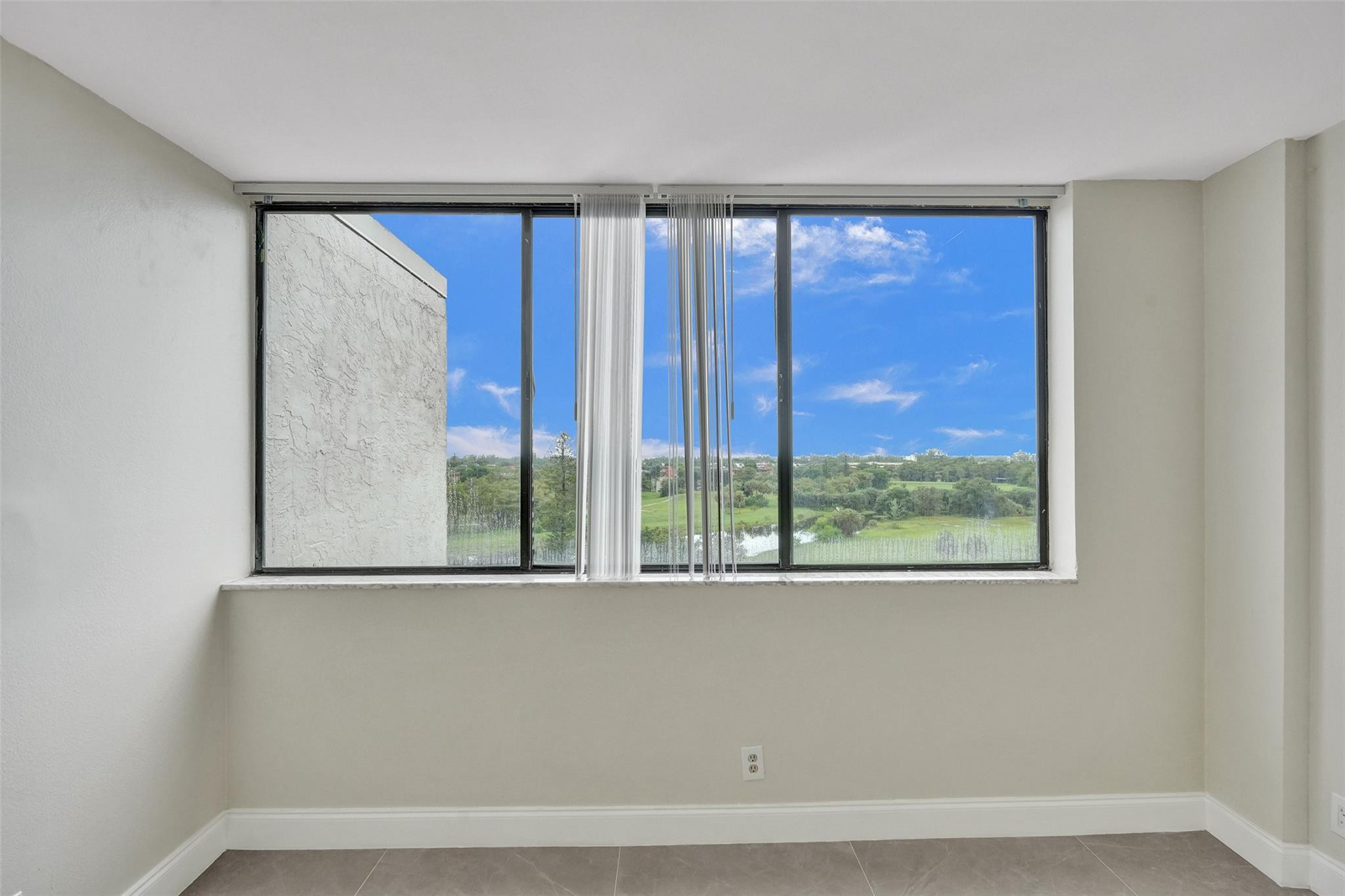 4222 Inverrary Boulevard, Unit 4810 Lauderhill, FL 33319 - Photo 45 of 63 a view of a room with a large window