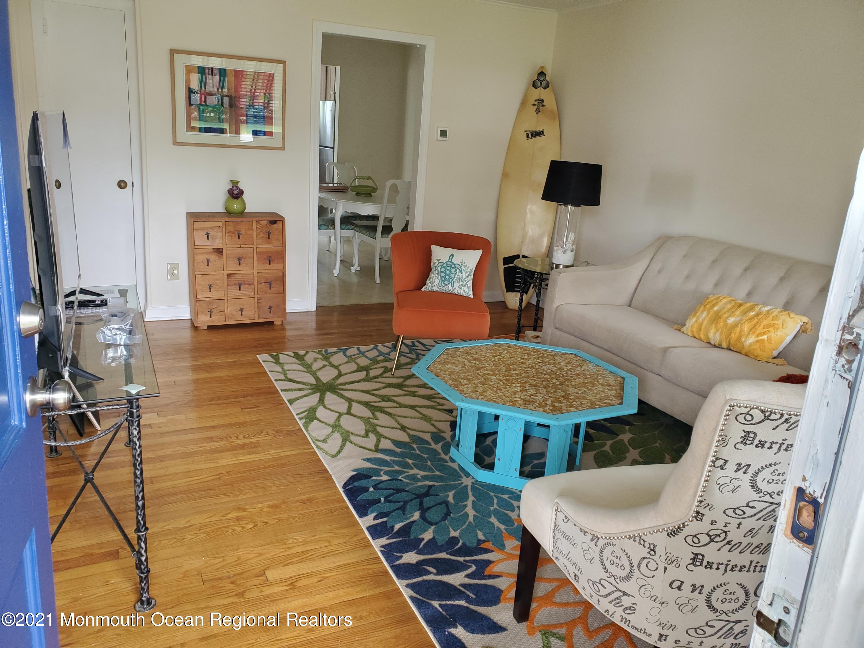 5 Calvert Avenue, Unit B Long Branch, NJ 07740 - Photo 2 of 12 a living room with furniture and a rug