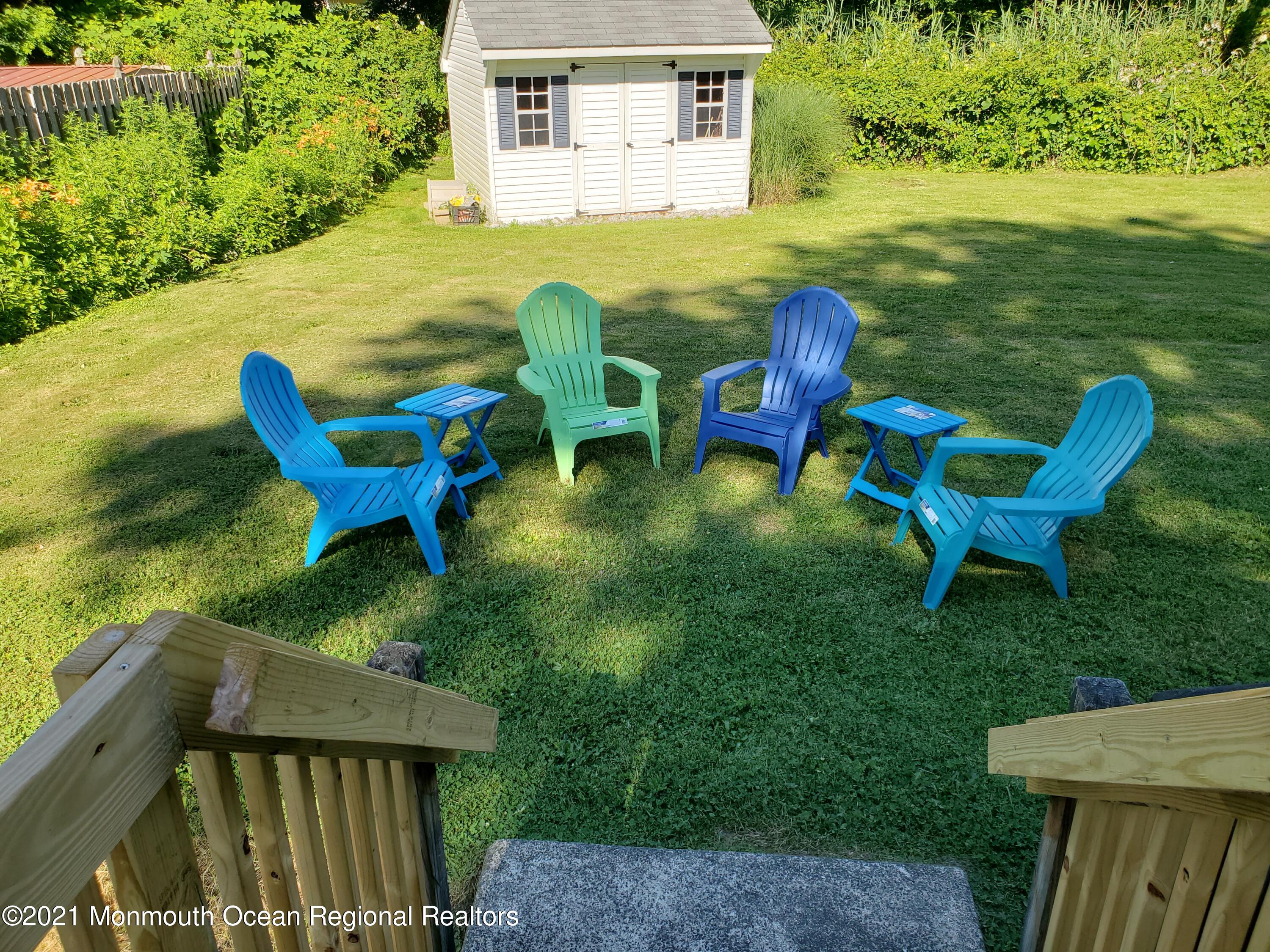 5 Calvert Avenue, Unit B Long Branch, NJ 07740 - Photo 12 of 12 a backyard of a house with table and chairs