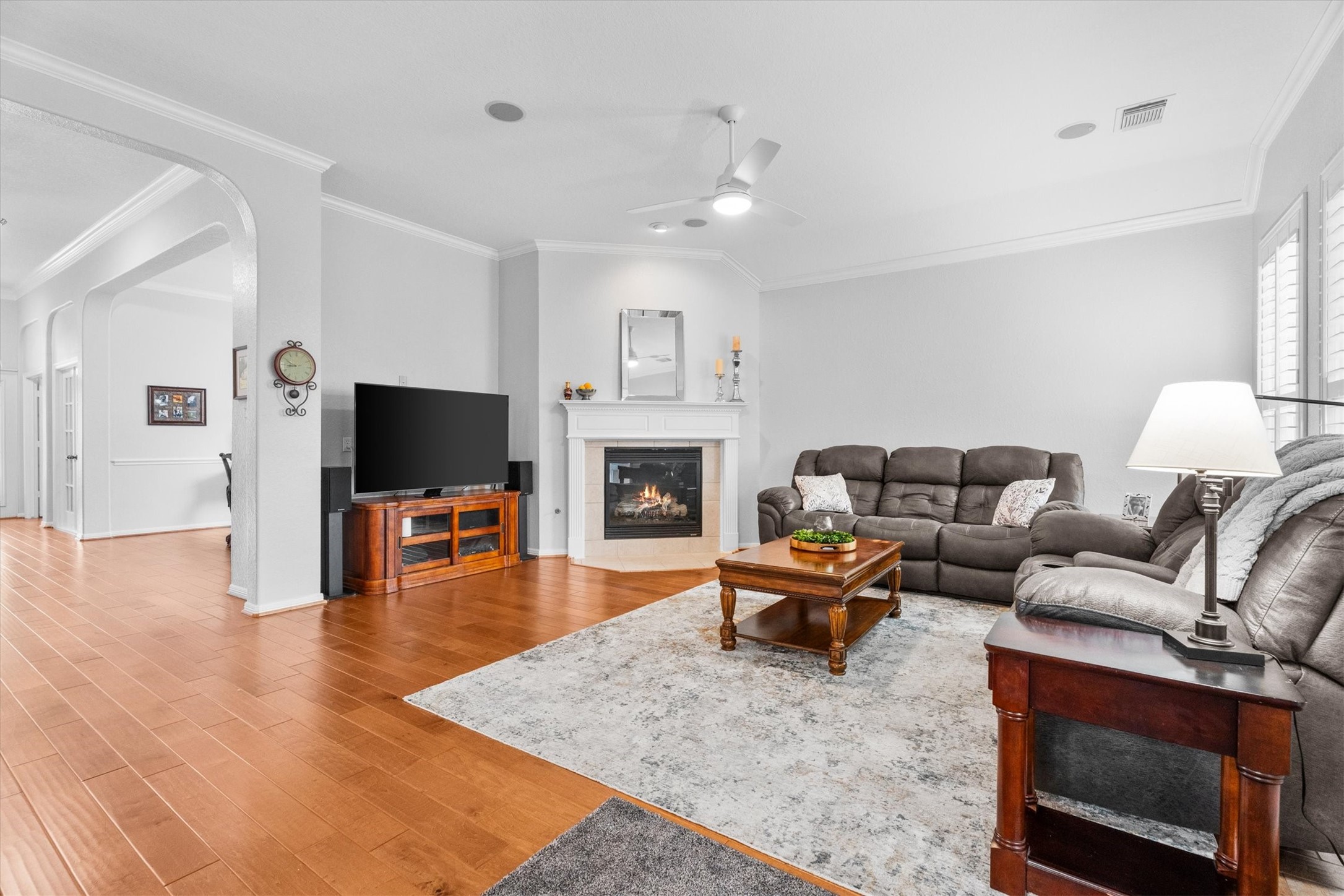 9406 Lochflora Drive Spring, TX 77379 - Photo 18 of 49 a living room with furniture and a flat screen tv