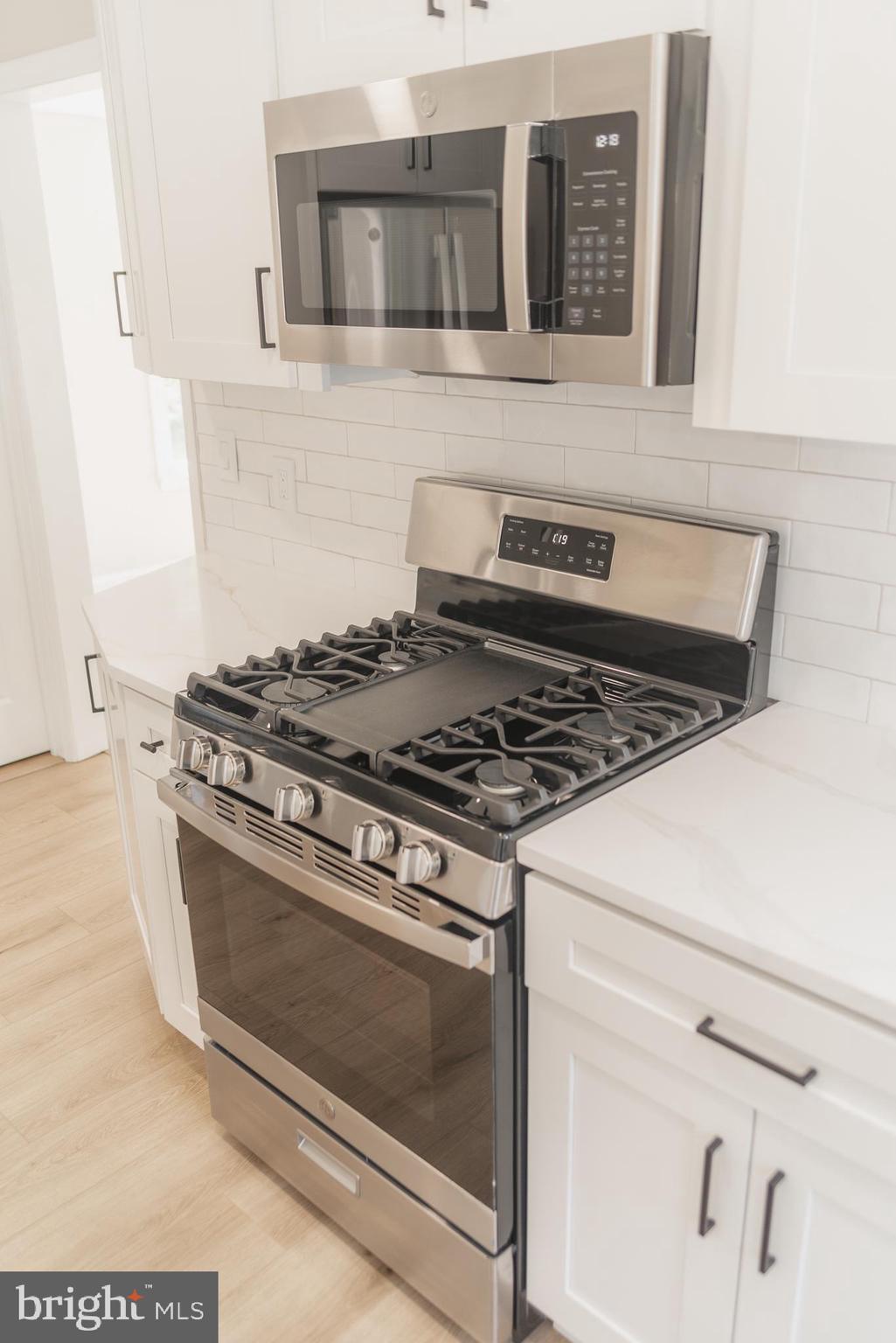 524 West Main Street Maple Shade, NJ 08052 - Photo 12 of 30 a stove top oven sitting inside of a kitchen