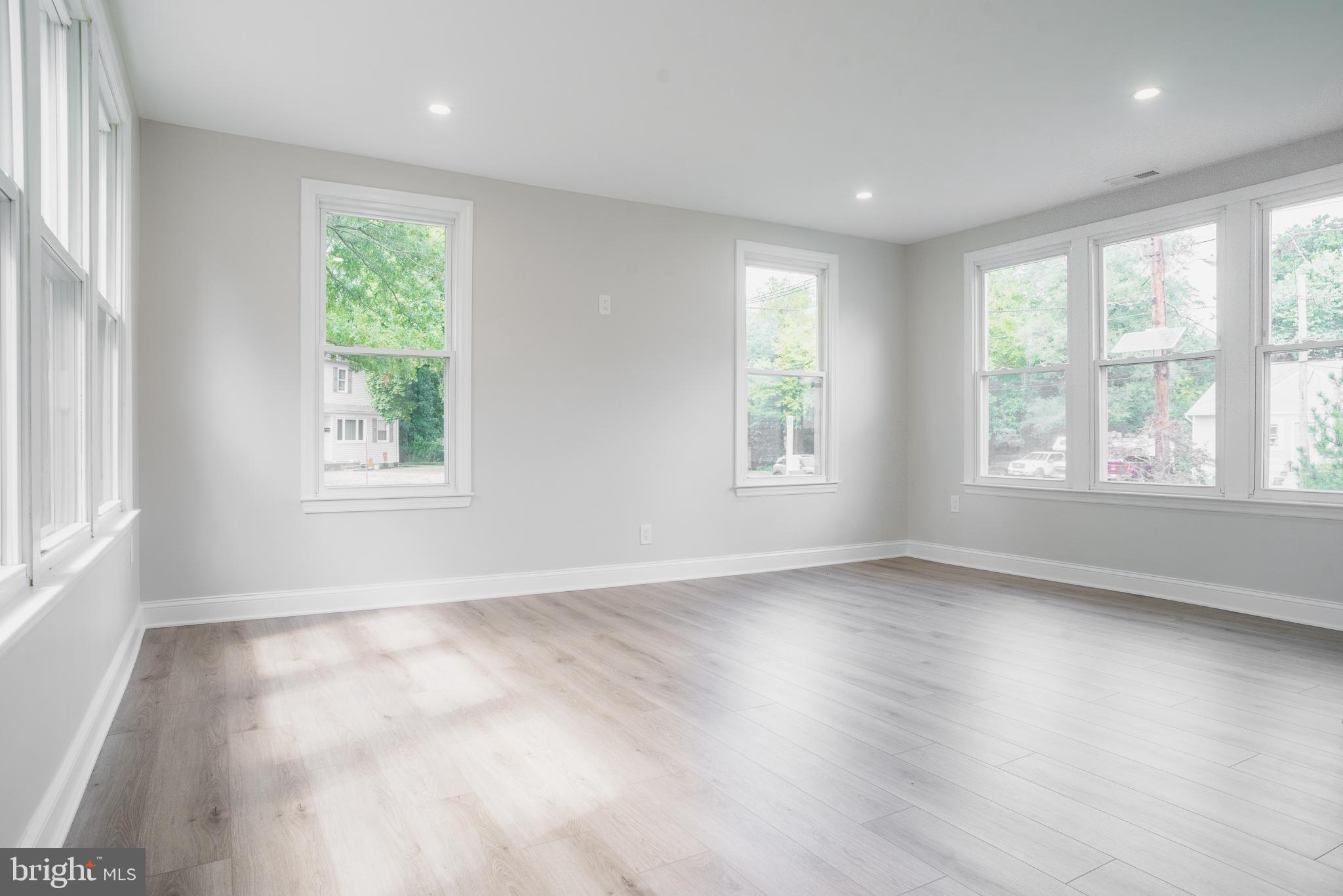 524 West Main Street Maple Shade, NJ 08052 - Photo 13 of 30 a view of an empty room with wooden floor and a window
