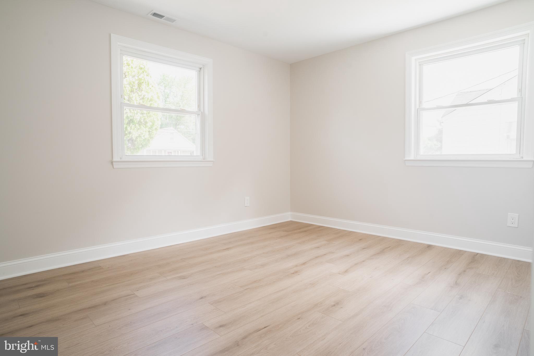 524 West Main Street Maple Shade, NJ 08052 - Photo 17 of 30 an empty room with wooden floor and windows
