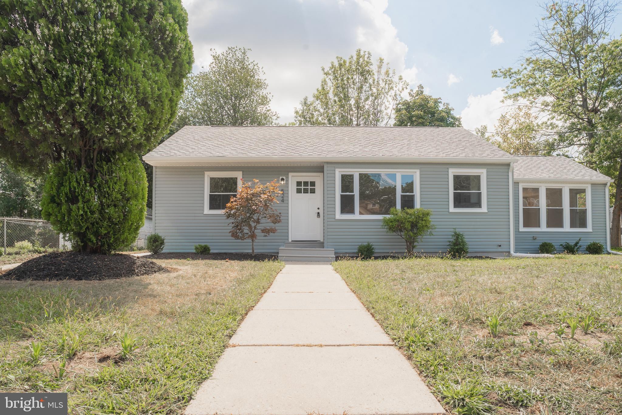 524 West Main Street Maple Shade, NJ 08052 - Photo 2 of 30 a front view of a house with a yard and garage