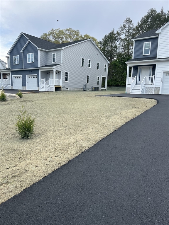 118 Thompson Road, Unit A Webster, MA 01570 - Photo 3 of 39 a view of house with outdoor space