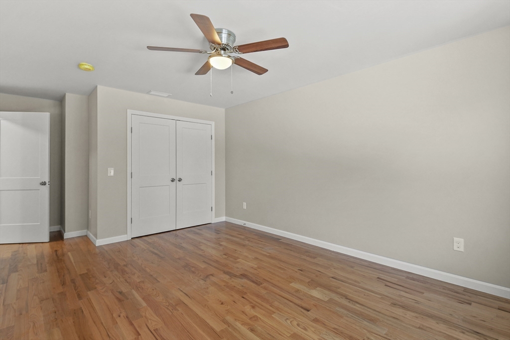 118 Thompson Road, Unit A Webster, MA 01570 - Photo 34 of 39 wooden floor in an empty room