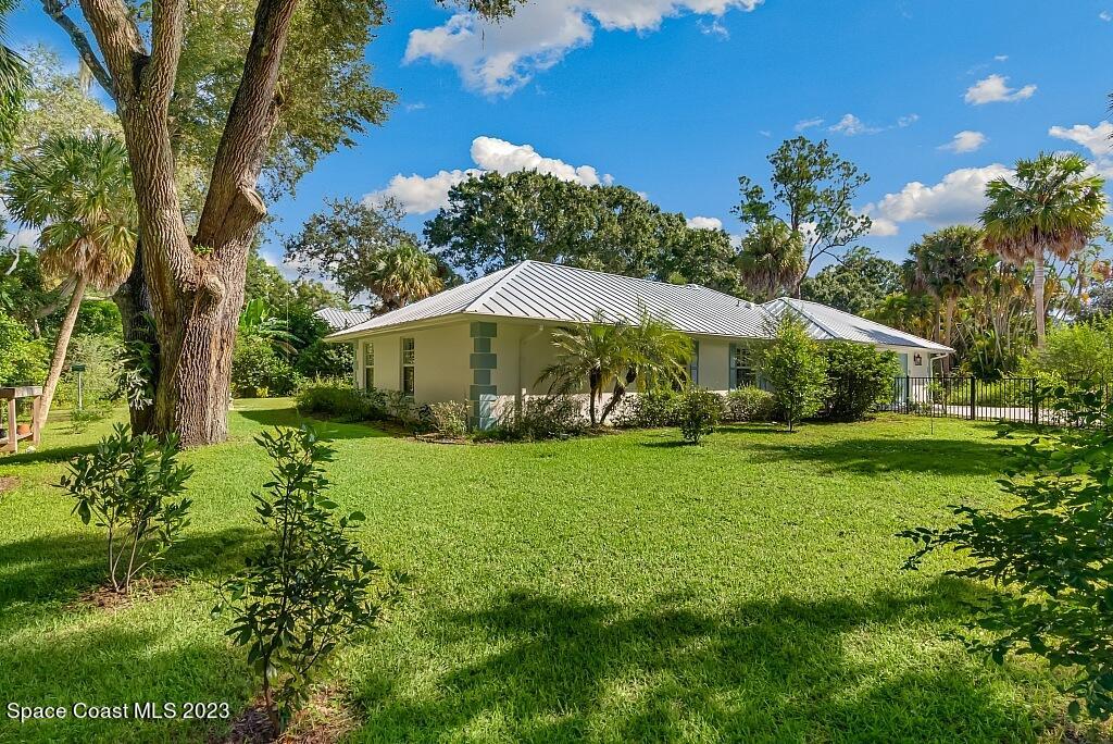 4307 2nd Square Southwest Vero Beach, FL 32968 - Photo 23 of 46 a view of a house with a yard