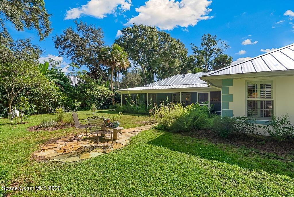 4307 2nd Square Southwest Vero Beach, FL 32968 - Photo 24 of 46 a view of a house with backyard and sitting area