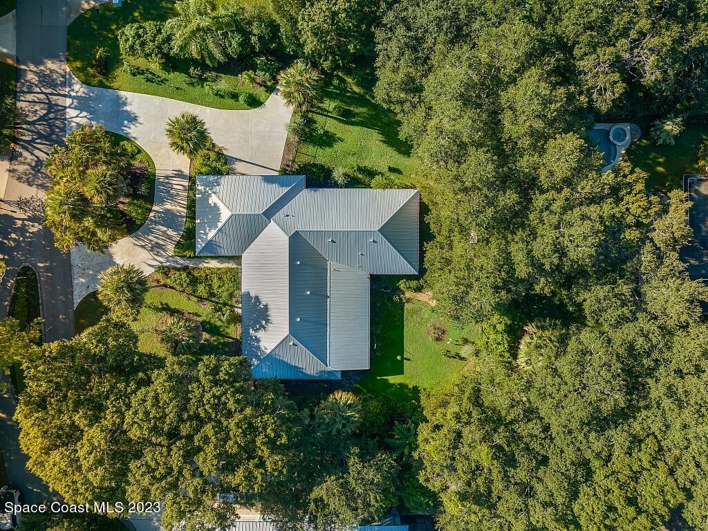 4307 2nd Square Southwest Vero Beach, FL 32968 - Photo 3 of 46 an aerial view of a house with a yard and garden