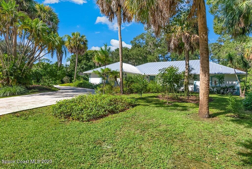 4307 2nd Square Southwest Vero Beach, FL 32968 - Photo 32 of 46 a view of a yard with palm trees