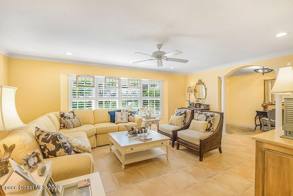 4307 2nd Square Southwest Vero Beach, FL 32968 - Photo 33 of 46 a living room with furniture and floor to ceiling windows