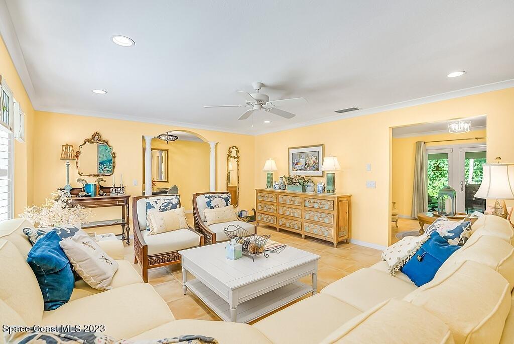 4307 2nd Square Southwest Vero Beach, FL 32968 - Photo 34 of 46 a living room with furniture and a large window