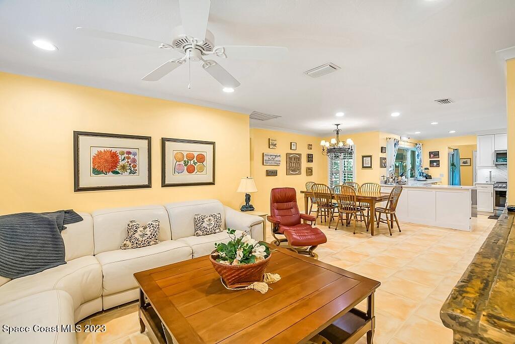 4307 2nd Square Southwest Vero Beach, FL 32968 - Photo 36 of 46 a living room with furniture and a table