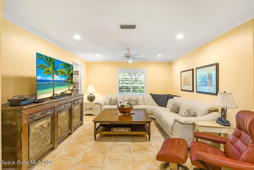 4307 2nd Square Southwest Vero Beach, FL 32968 - Photo 37 of 46 a living room with furniture and a flat screen tv