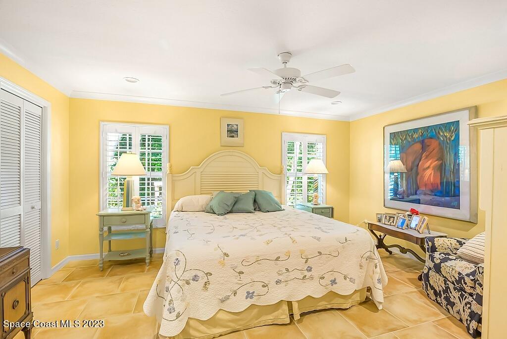 4307 2nd Square Southwest Vero Beach, FL 32968 - Photo 41 of 46 a bedroom with a bed and a window