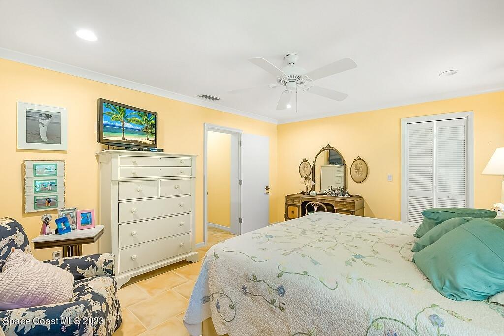 4307 2nd Square Southwest Vero Beach, FL 32968 - Photo 42 of 46 a bedroom with a bed and wooden floor