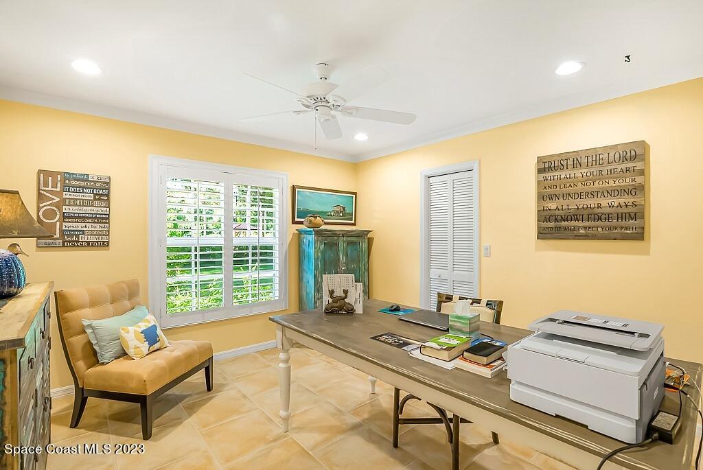 4307 2nd Square Southwest Vero Beach, FL 32968 - Photo 43 of 46 a living room with furniture and a floor to ceiling window