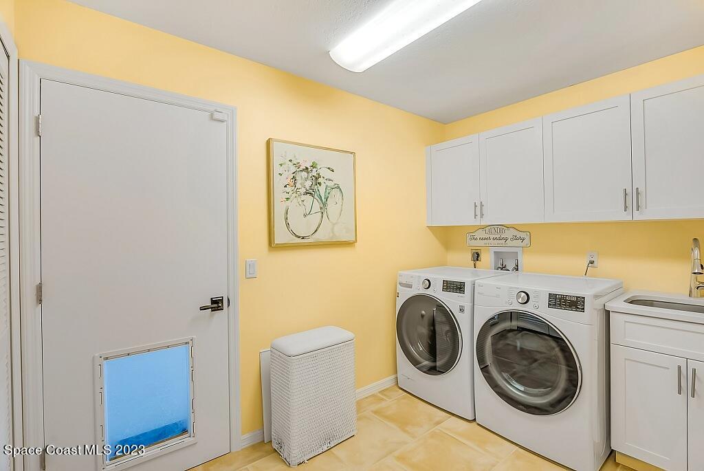 4307 2nd Square Southwest Vero Beach, FL 32968 - Photo 45 of 46 a utility room with dryer and washer