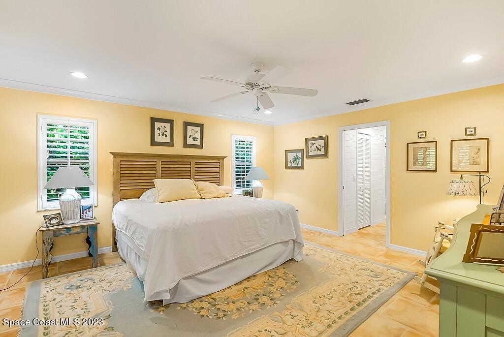4307 2nd Square Southwest Vero Beach, FL 32968 - Photo 6 of 46 a bedroom with a large bed and a couch