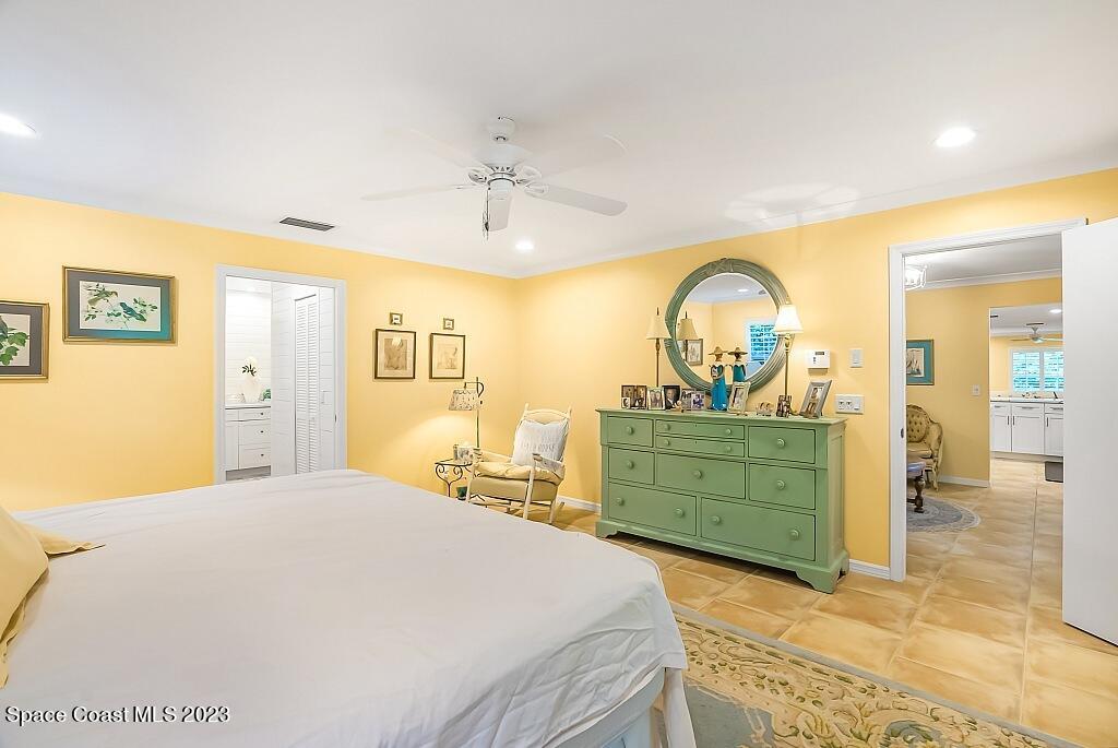 4307 2nd Square Southwest Vero Beach, FL 32968 - Photo 7 of 46 a bedroom with a bed and a dresser