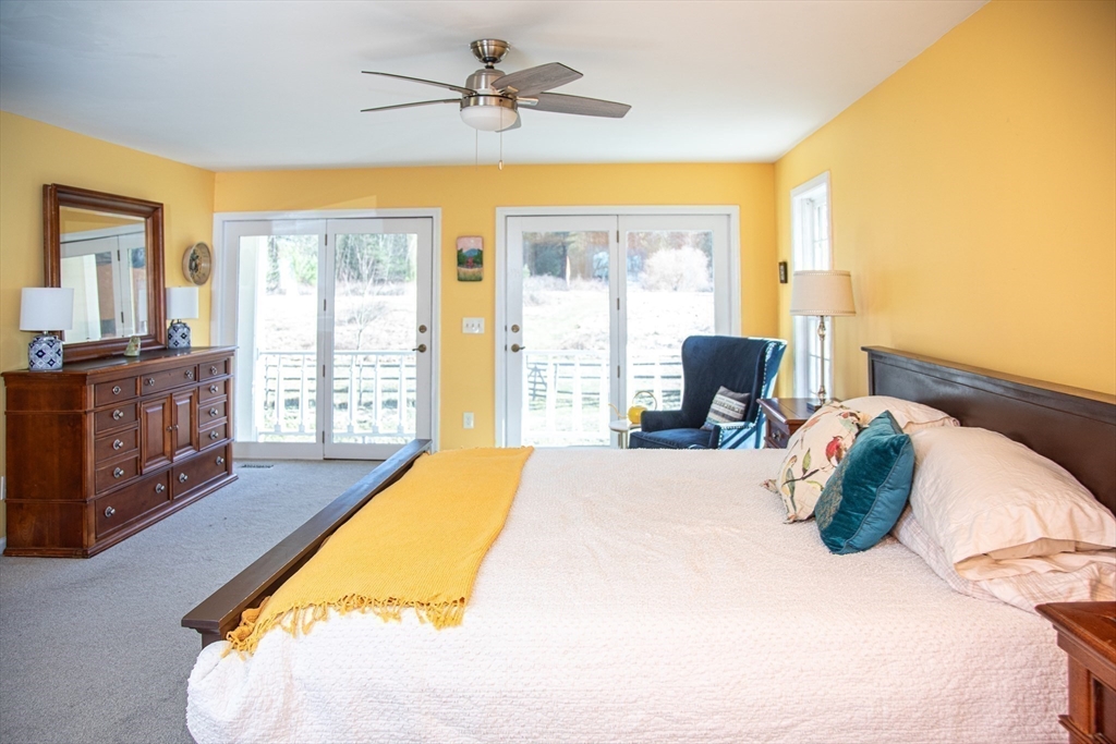 435 Market Hill Road Amherst, MA 01002 - Photo 20 of 42 a bed sitting in a bedroom next to a window