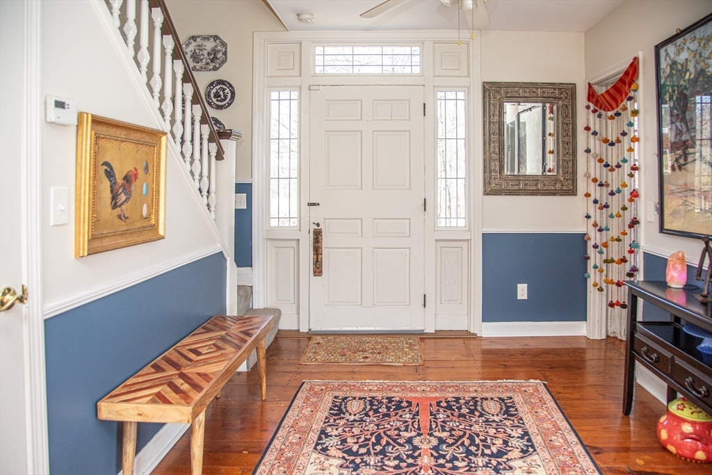 435 Market Hill Road Amherst, MA 01002 - Photo 3 of 42 a bedroom with a bed and wooden floor