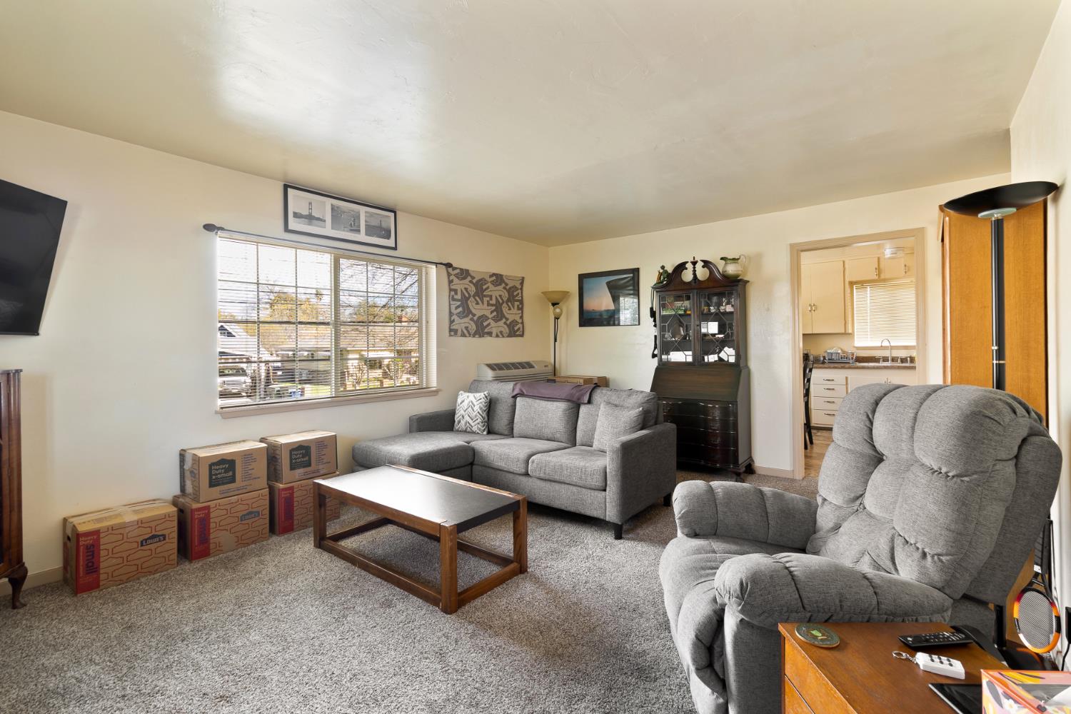 504 West Marlette Street Ione, CA 95640 - Photo 30 of 53 a living room with furniture and a window