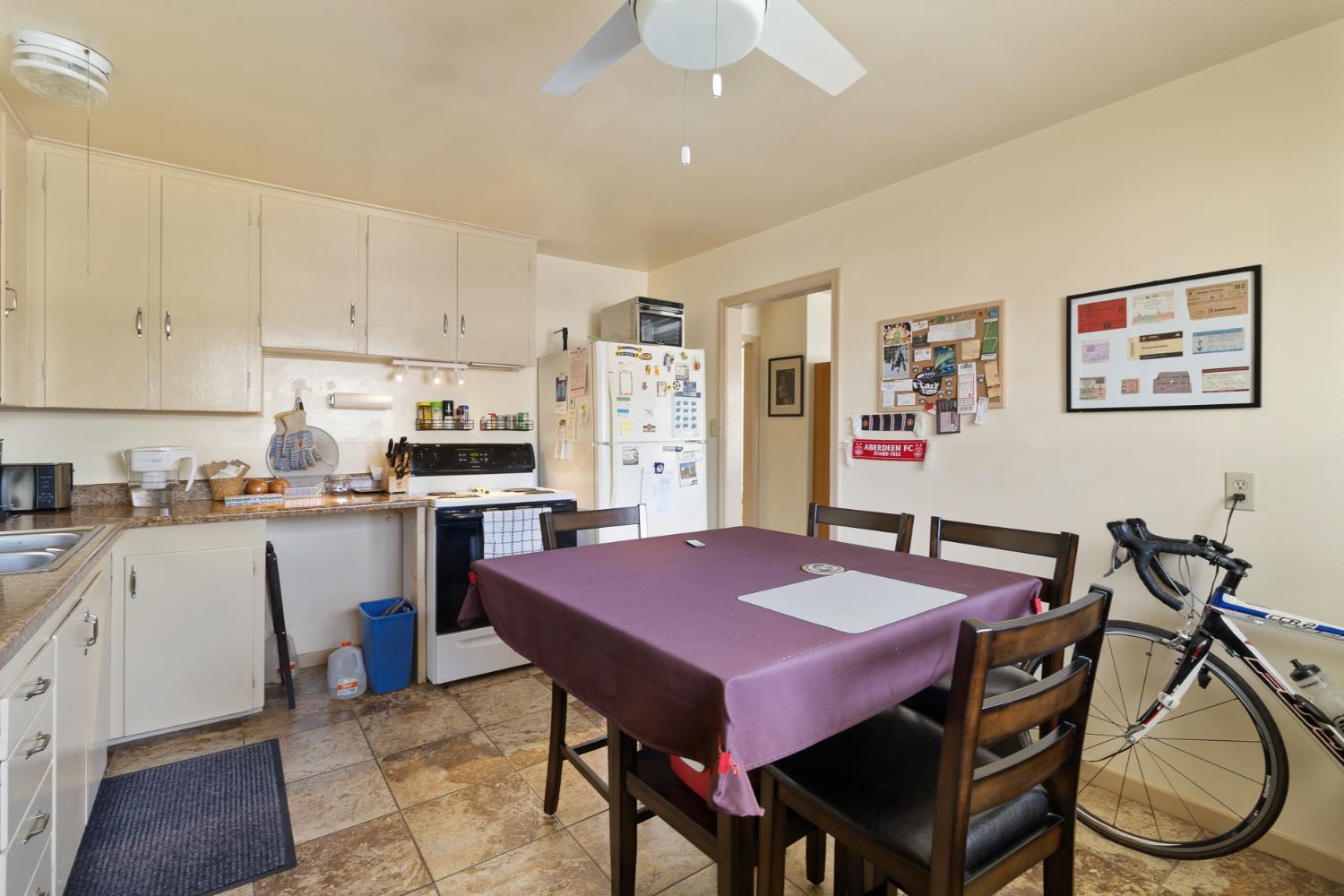 504 West Marlette Street Ione, CA 95640 - Photo 35 of 53 a view of kitchen with cabinets dining table and chairs