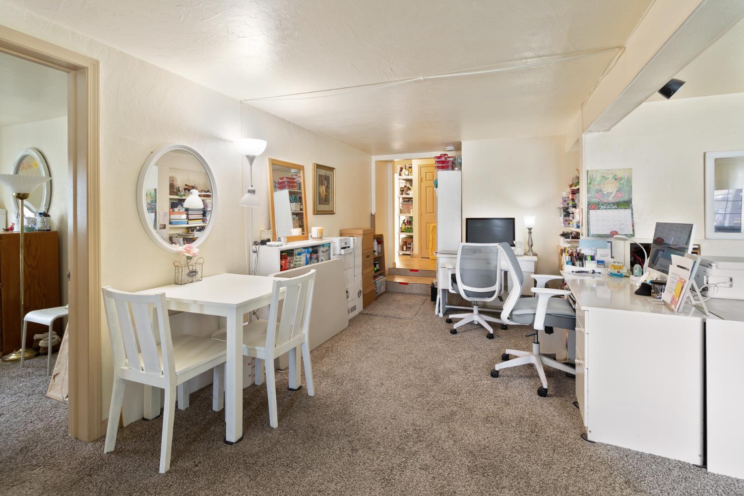 504 West Marlette Street Ione, CA 95640 - Photo 6 of 53 a view of a dining room with furniture and a chandelier
